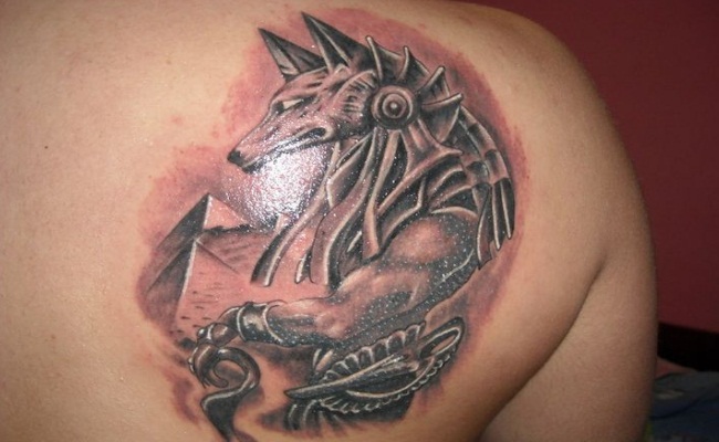 Black And Grey Ink Anubis Tattoo On Right Back Shoulder