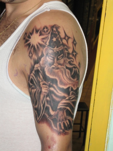 Black And Grey Wizard Tattoo On Left Half Sleeve