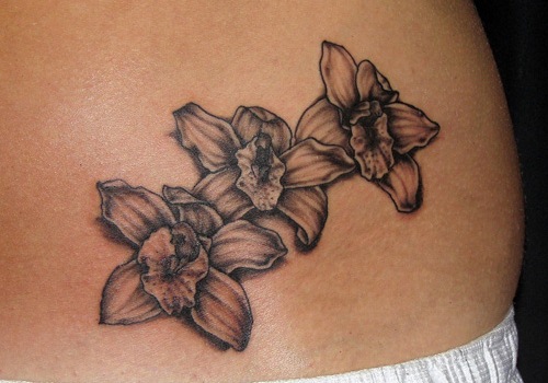 Black And White Orchid Tattoo On Lower Back