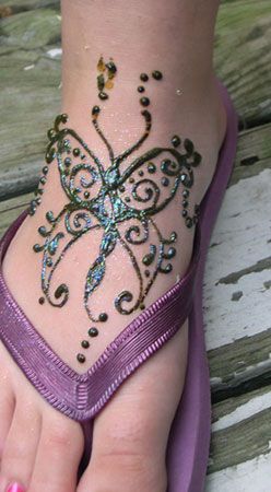 Black Henna Butterfly Tattoo On Girl Right Foot