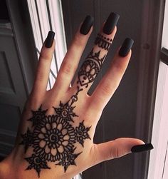 Black Henna Flower Tattoo On Girl Left Hand