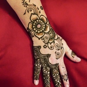 Black Henna Flower Tattoo On Right Hand