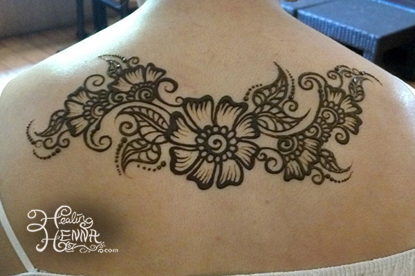 Black Henna Flowers Tattoo On Upper Back