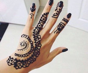 Black Henna Tattoo On Girl Left Hand