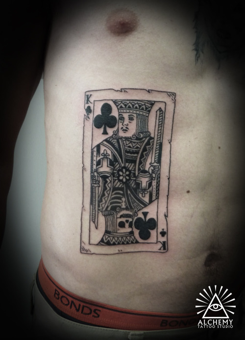 Black Ink King Card Tattoo On Man Side Rib