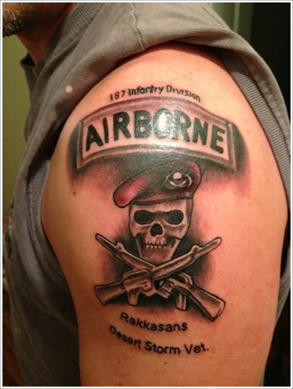 Black Ink Military Skull With Two Crossing Gun Tattoo On Shoulder