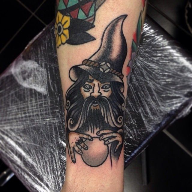 Black Ink Traditional Wizard Tattoo On Forearm