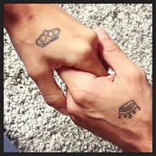 Black Outline King And Queen Crown Tattoo On Couple Hand