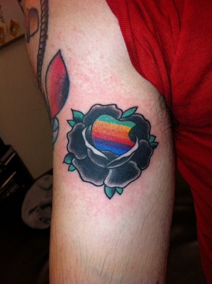 Black Rose And Colorful Geek Tattoo On Bicep