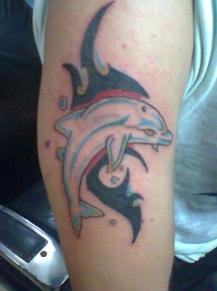 Black Tribal And Dolphin Tattoo On Right Bicep