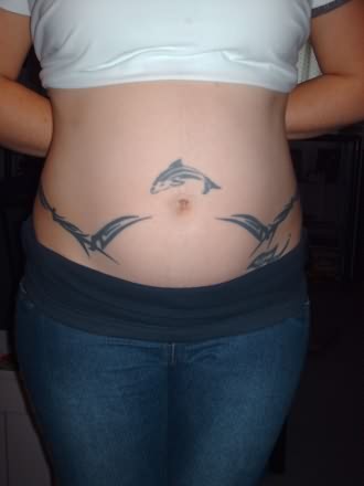 Black Tribal And Dolphin Tattoos On Stomach