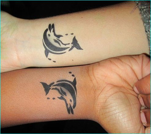 Black Tribal Dolphin Tattoos On Wrist