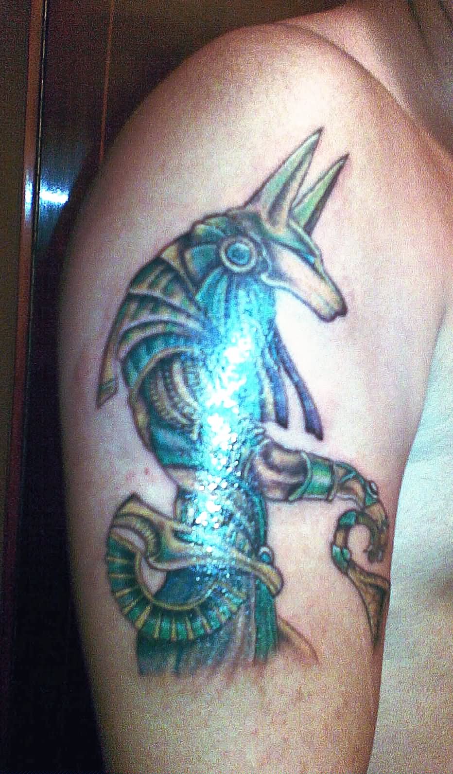 Blue Ink Anubis Tattoo On Right Half Sleeve