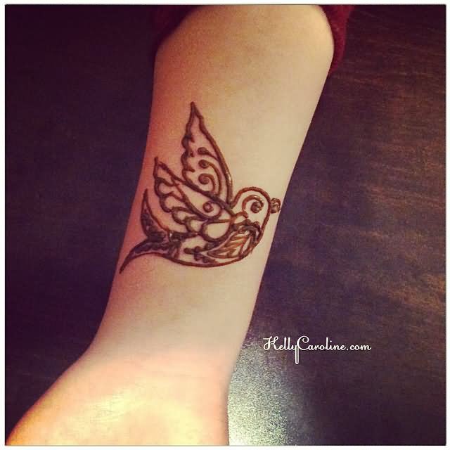 Classic Henna Bird Tattoo On Wrist By Kelly Caroline