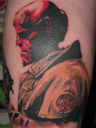 Color Ink Evil Geek Tattoo On Back Leg