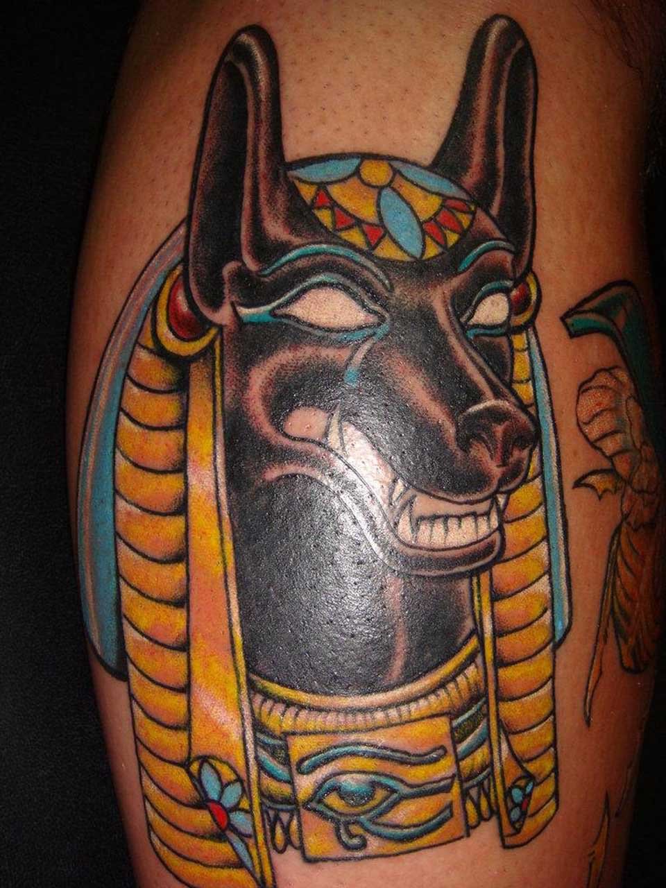 Colored Egyptian Anubis Tattoo On Back Leg