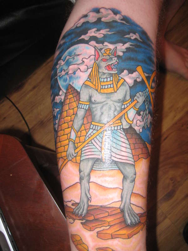 Colored Egyptian Lord Anubis Tattoo On Leg