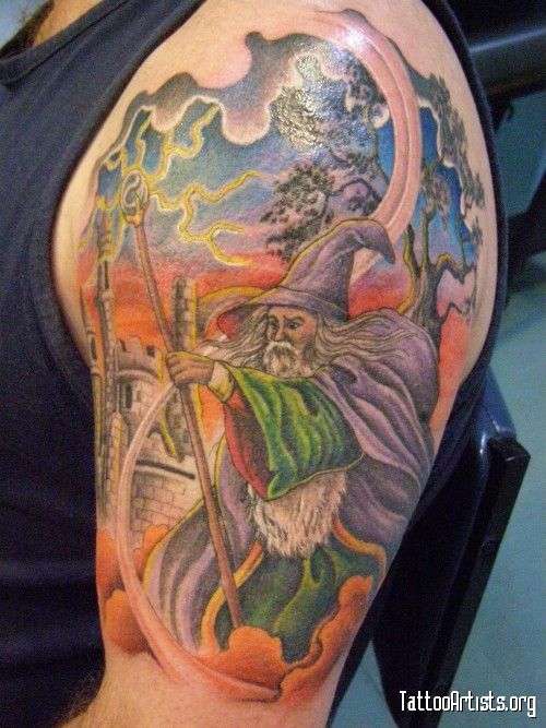 Colored Wizard Tattoo On Man Left Half Sleeve
