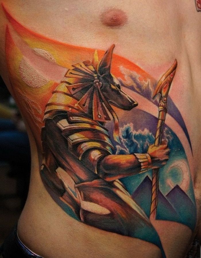 Colorful Egyptian Anubis Tattoo On Man Side Rib