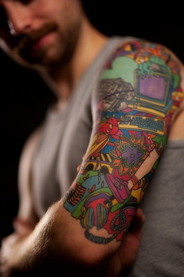 Colorful Geek Tattoo On Left Half Sleeve