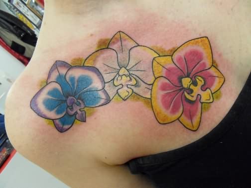 Colorful Orchid Tattoos On Girl Front Shoulder