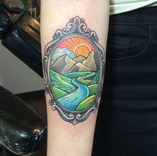 Colorful Scenery In Frame Tattoo On Forearm