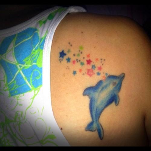 Colorful Stars And Dolphin Tattoo On Right Back Shoulder