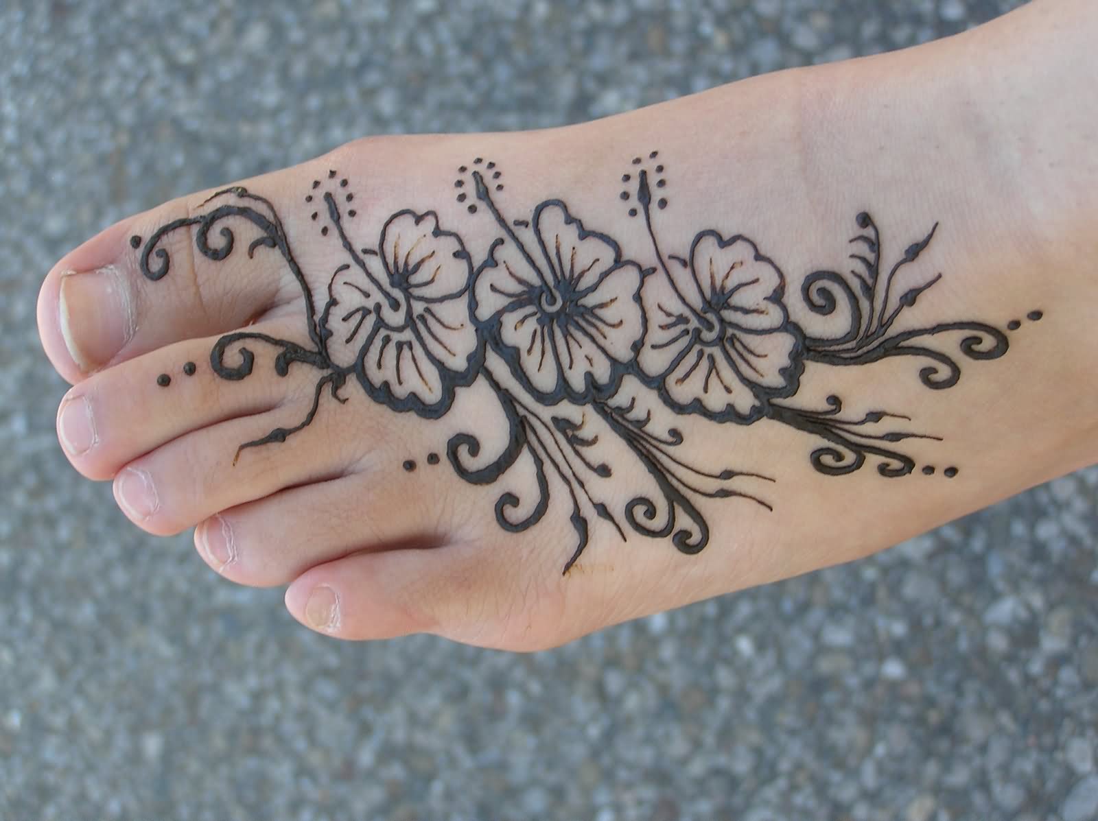 Cool Black Henna Flowers Tattoo On Left Foot