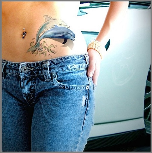 Dolphin Tattoo On Girl Left Hip