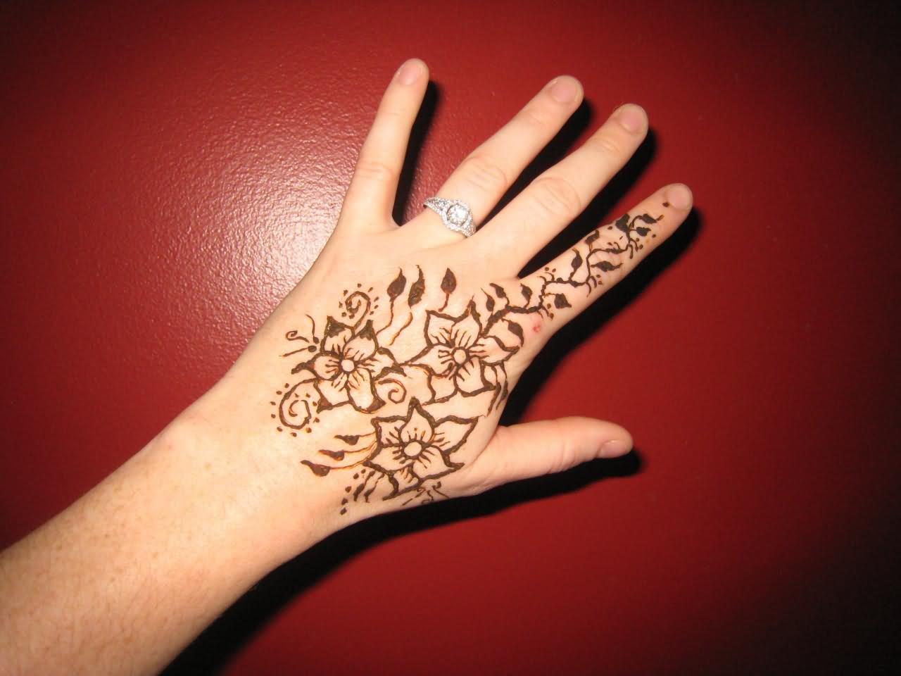 Fantastic Henna Flowers Tattoo On Left Hand