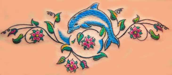 Flowers And Blue Dolphin Tattoo On Back