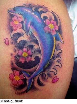Flowers And Dolphin Tattoo On Leg