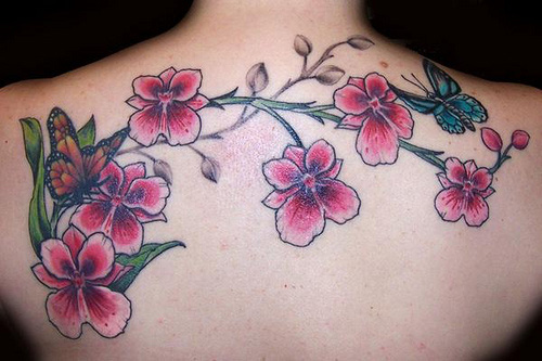 Girl Upper Back Butterfly On Orchid Flowers Tattoo