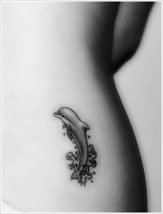 Grey Ink Dolphin Tattoo On Lower Back