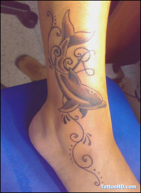 Grey Ink Dolphin Tattoo On Right Leg