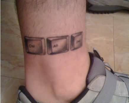 Grey Ink Geek Tattoo On Leg