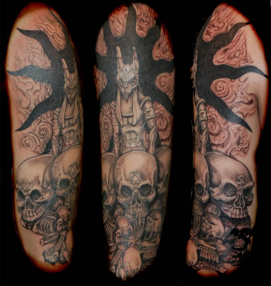 Grey Ink Skulls And Anubis Tattoo On Half Sleeve by Johnjeffries