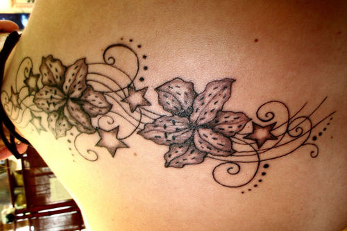 Grey Ink Stars And Orchid Tattoo