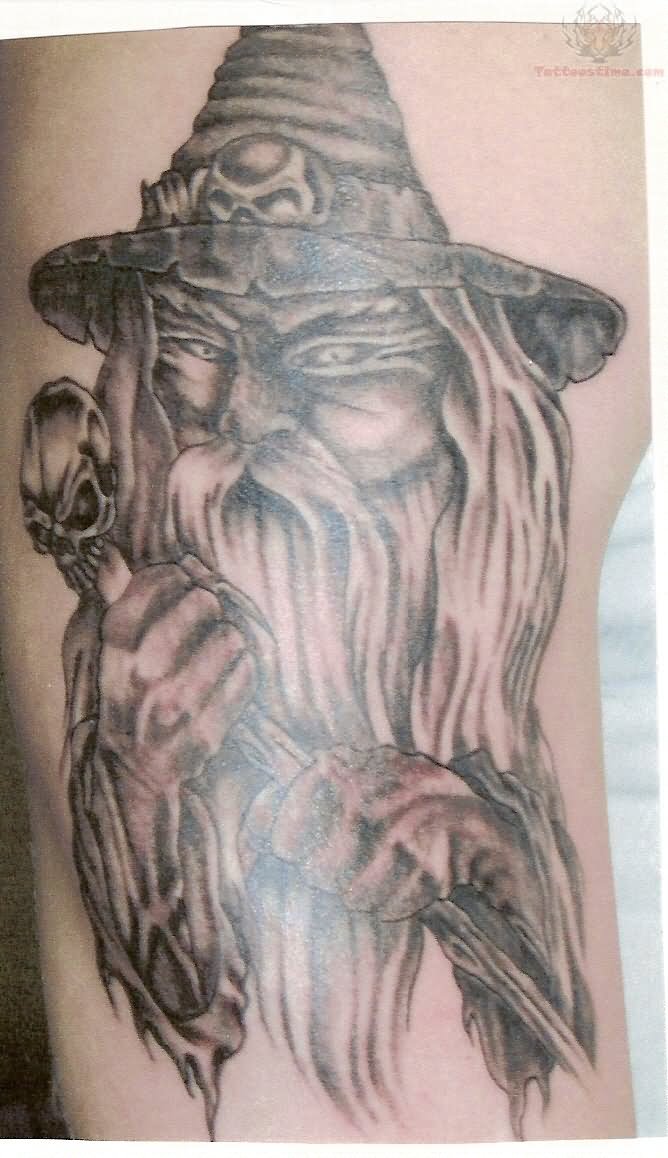 Grey Ink Wizard Tattoo On Bicep