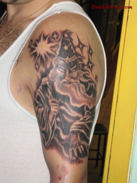Grey Ink Wizard Tattoo On Man Left Half Sleeve