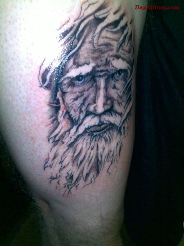 Grey Ink Wizard Tattoo On Right Bicep
