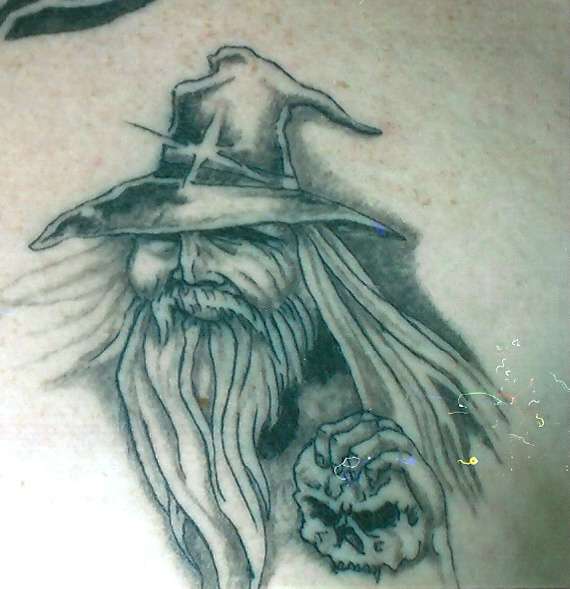 Grey Ink Wizard With Skull Tattoo On Left Back Shoulder