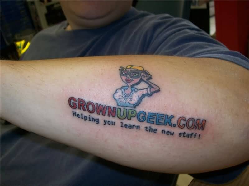Grown Up Geek Tattoo On Left Forearm