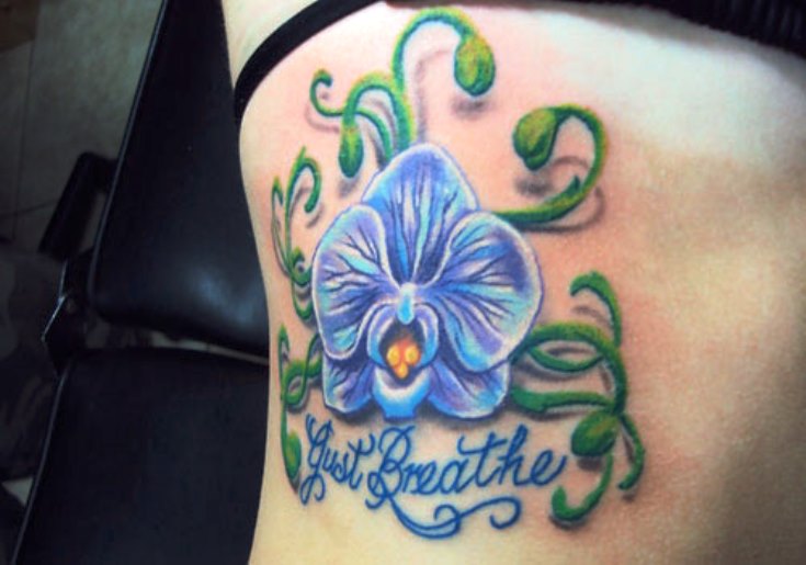 Gust Breathe Blue Orchid Tattoo On Side Rib