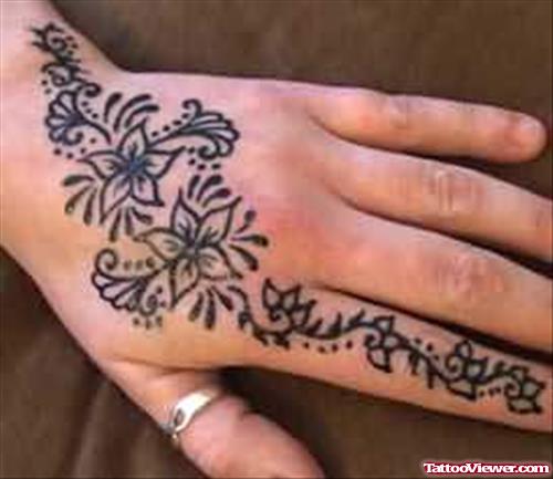 Henna Flowers Tattoo On Left Hand