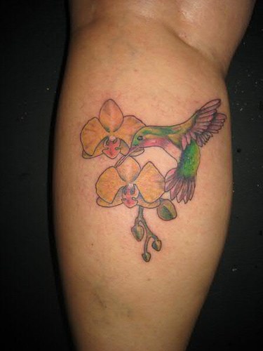 Hummingbird And Orchid Back Leg Tattoo