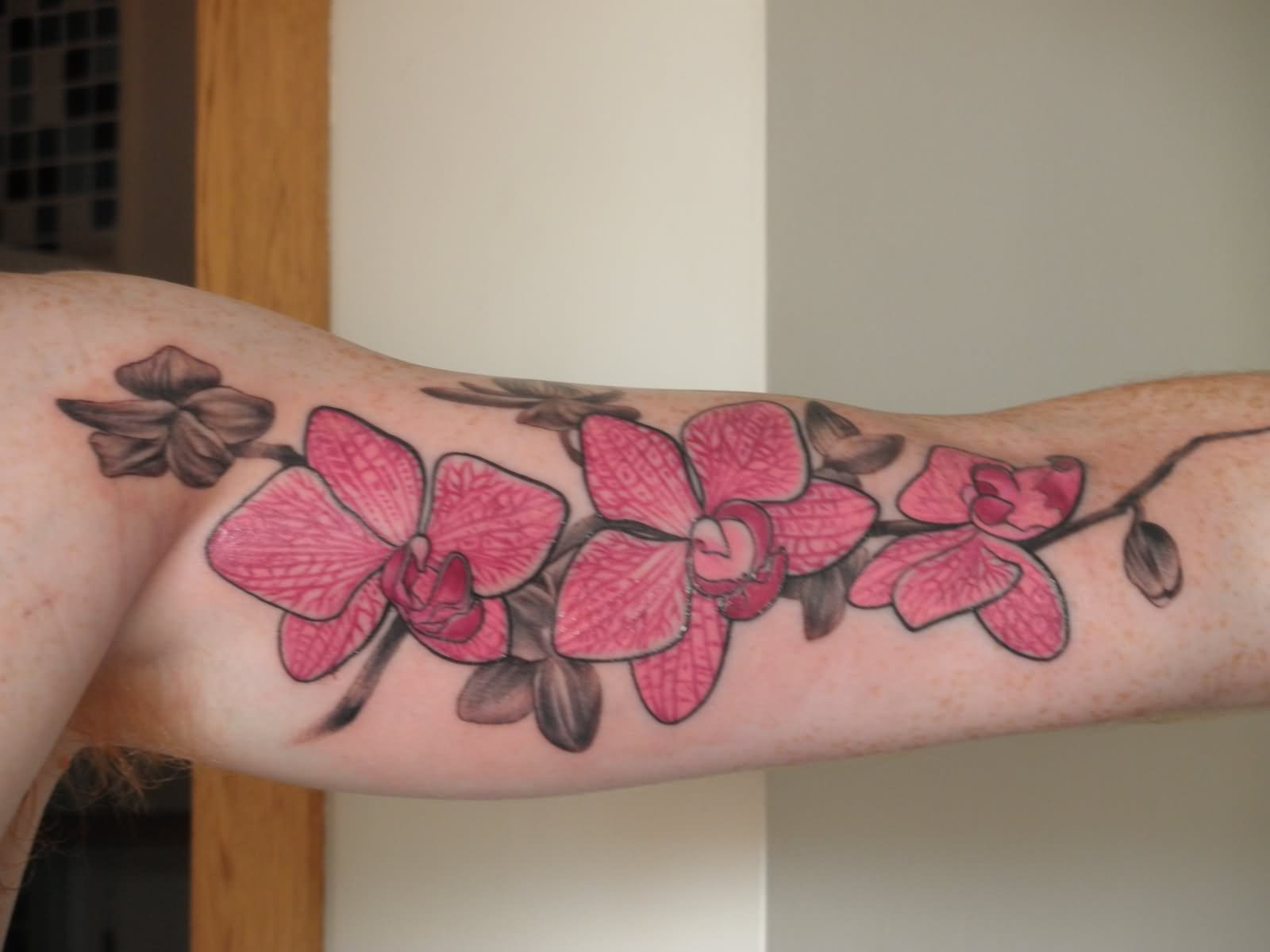 Inner Bicep Orchid Tattoo For Men