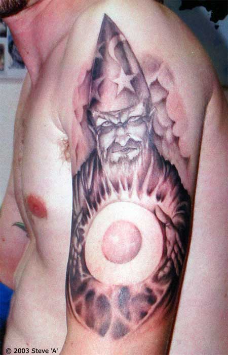 Left Half Sleeve Wizard With Crystal Ball Tattoo For Men