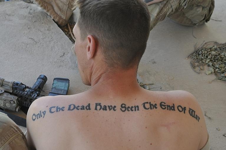 Military Quotes Tattoo On Man Upper Back