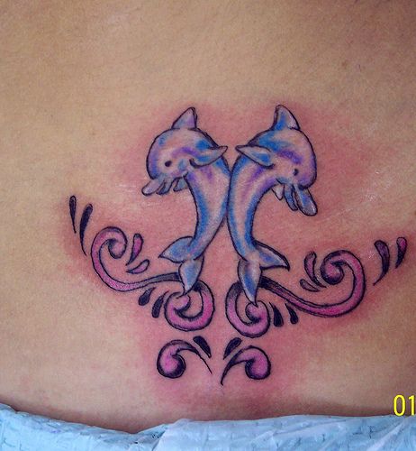 Nice Blue Ink Dolphin Tattoos On Lower Back